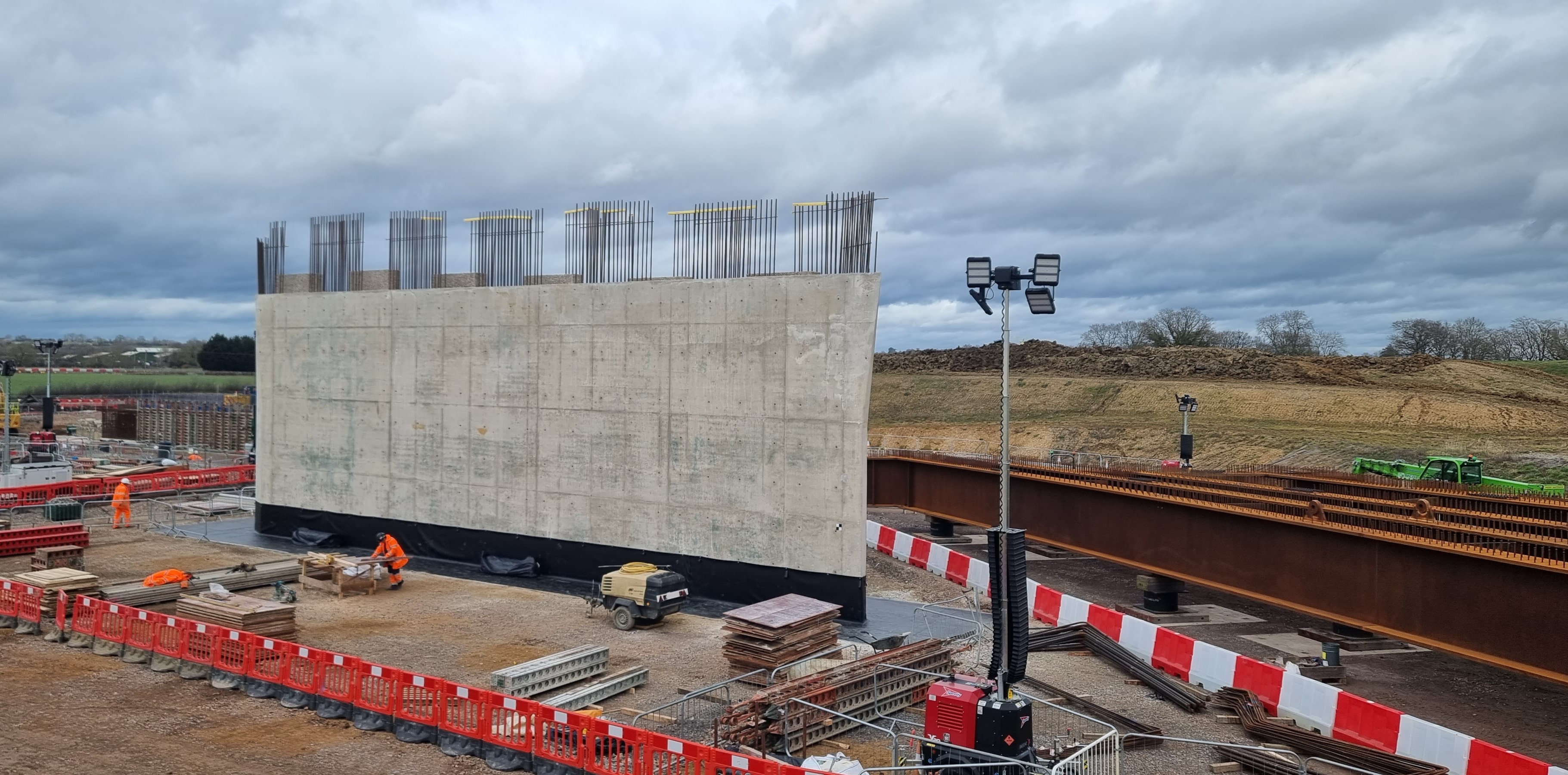 Abutment wall with starter bars and steel beams