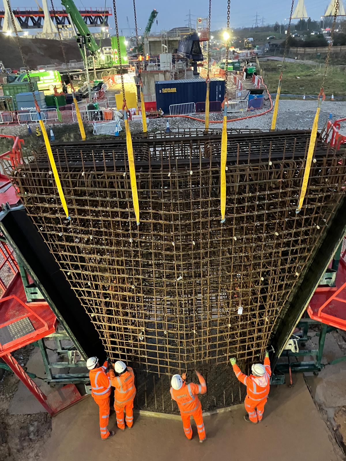 Massive rebar cage with operatives for scale