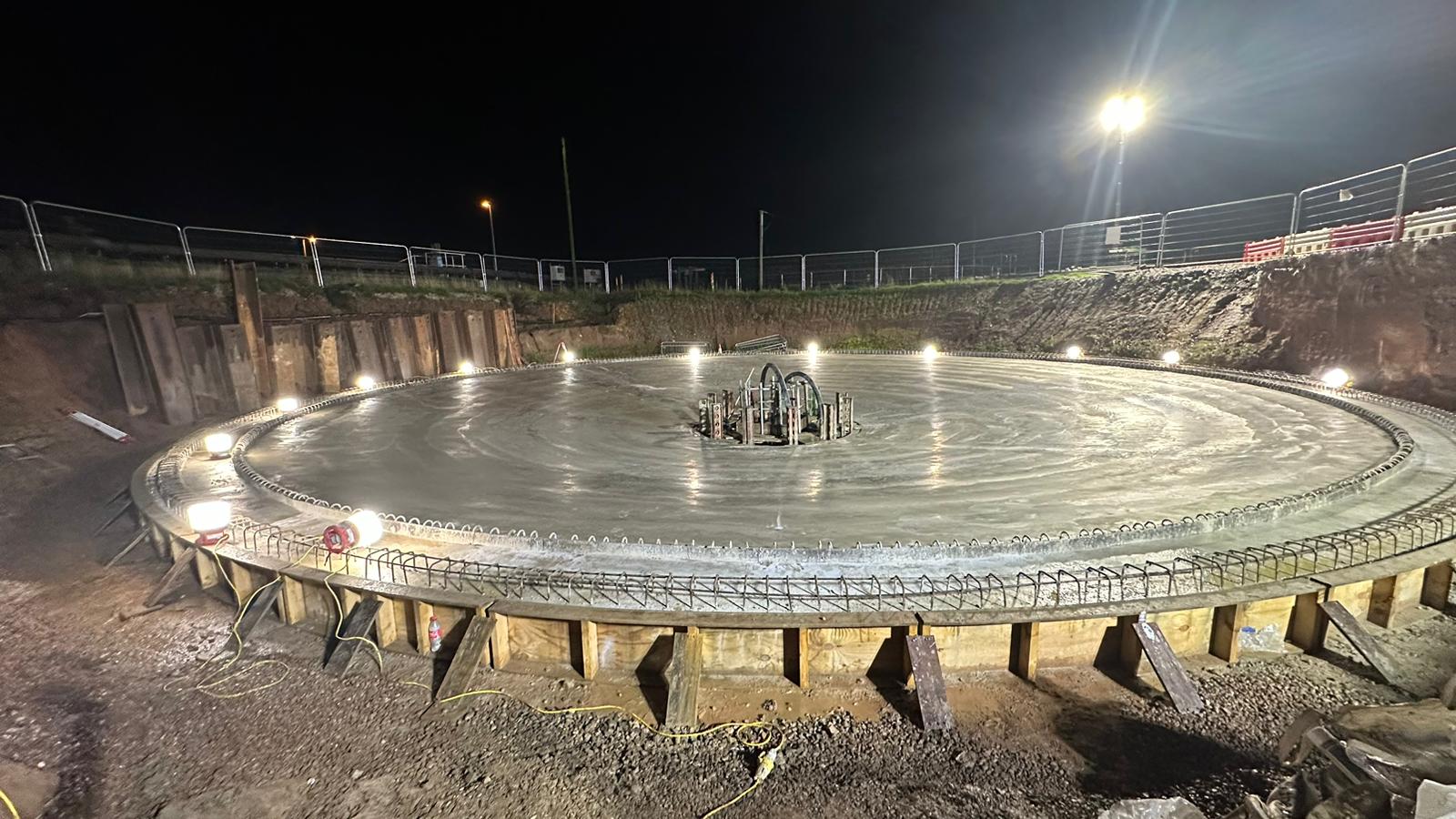 Settlement tank base slab — night pour under floodlights